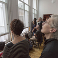 Audience watching performers through the courtyard<br/>Photo by Richard Termine