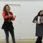 Heather Green and Jennifer Miller - <a href="https://cathyweis.org/calendar/sundays-on-broadway-live-performances/" target="outside">March 1, 2015</a> <br/>Still from video by Davidson Gigiotti