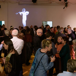 Audience in front of a wall with projected video compilation of past Sundays on Broadway performances at the first ever Gala featuring Meredith Monk - November 19, 2019 <br/>Photo by Ian Douglas